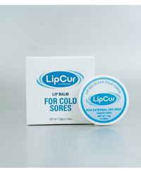 Lip balm container and packaging with 'LipCur' branding on a gray background